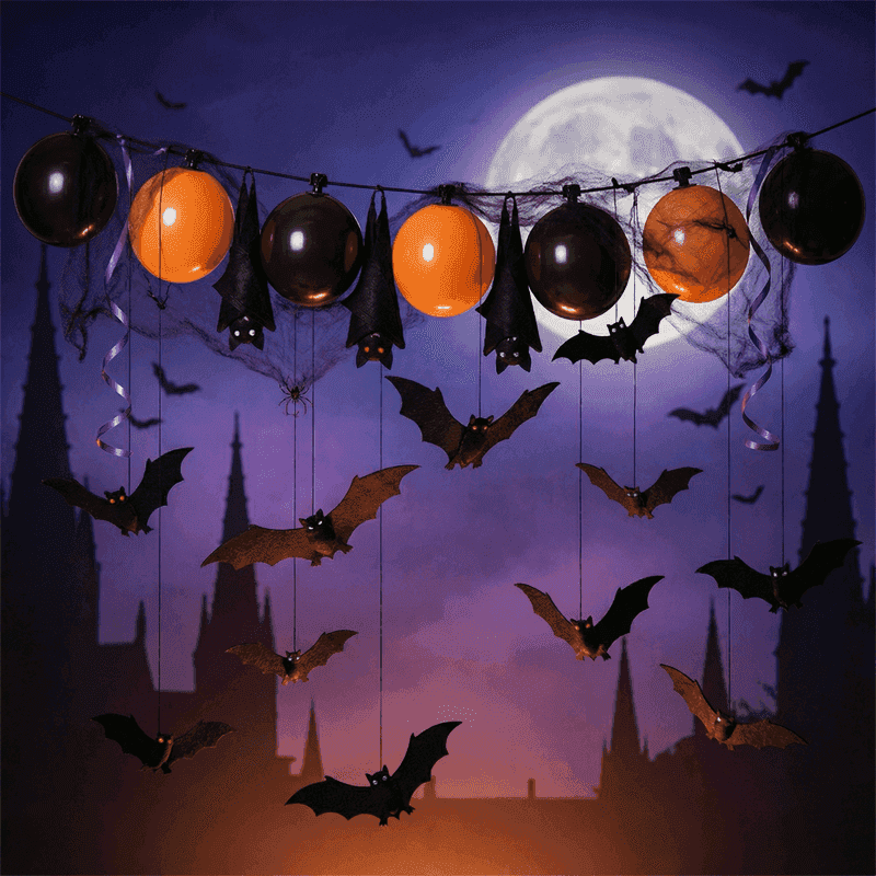 PilaMania ballonslinger gedecoreerd voor Halloween met uitvliegende vleermuiszwerm — slapende, opstijgende en vliegende vleermuizen creëren dynamisch bat swarm effect voor herbruikbare Halloween ballondecoratie